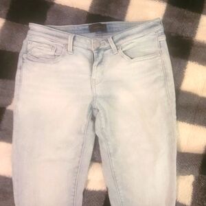 Buckle black skinny jeans